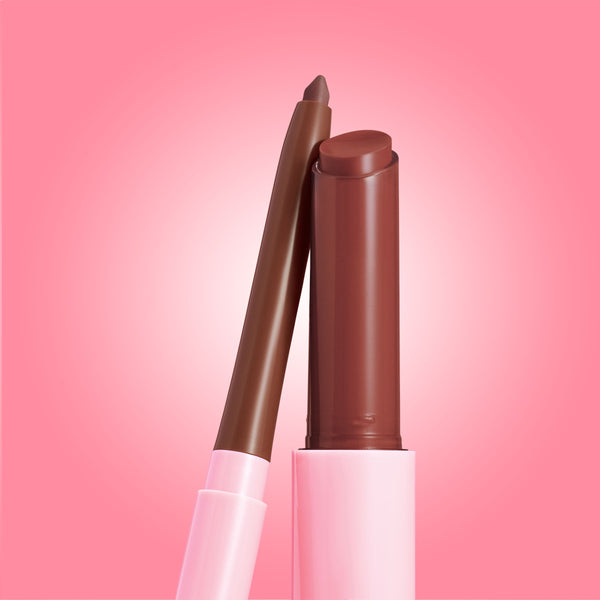 ColourPop So Juicy Plumping Lip Liner & Balm Set, Smooches, showing a twist-up neutral brown liner leaning against an open creamy brown balm in pink tubes, set upright on a soft pink gradient background.