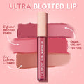 ColourPop Ultra Blotted Lip OG Babes tube standing upright, showcasing a diffused blotted finish with rosy pink and nude swatches on a pink backdrop, highlighting smooth, creamy texture and long‑lasting, comfortable wear.