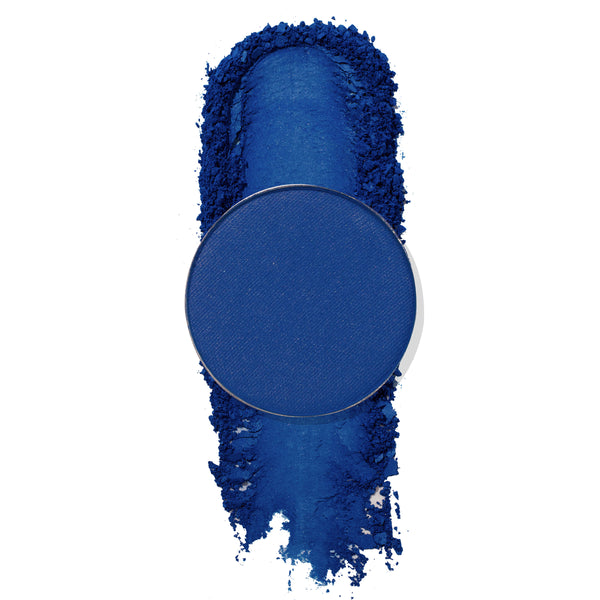 ColourPop Backstage Pressed Powder Shadow in matte cobalt blue, pan centered over a bold swatch with crushed pigment edges on a white background, showcasing smooth, highly pigmented payoff for eye looks.