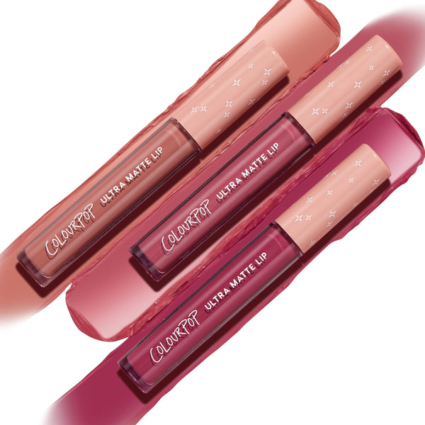 ColourPop Ultra Matte Lip Berry Pickin' bundle displaying three liquid lipsticks gliding across nude, rose, and berry swatches, with blush-pink starry caps arranged diagonally to highlight the bold, long-wear ultra-matte finish.
