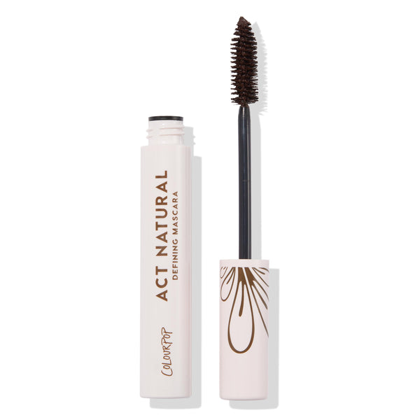 ColourPop Act Natural Mascara in Brown, open tube showing spoolie wand coated in brown formula beside a pale pink tube with brown “Act Natural Defining Mascara” text and droplet motif, product standing upright on a white background.