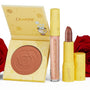 Kind at Heart ColourPop Lip & Cheek Set featuring an open rose-embossed blush compact with Chip illustration, a pearly Ultra Glossy Lip, and mauve bullet lipstick in yellow rose-print packaging, styled on white with red roses.