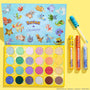 Ready For Battle ColourPop Shadow Palette & Ultra Glossy Lip Set showcasing an open 30-pan eyeshadow palette with Pokémon artwork and three glosses (yellow, orange, blue, one wand open) arranged in a bright yellow flatlay background.