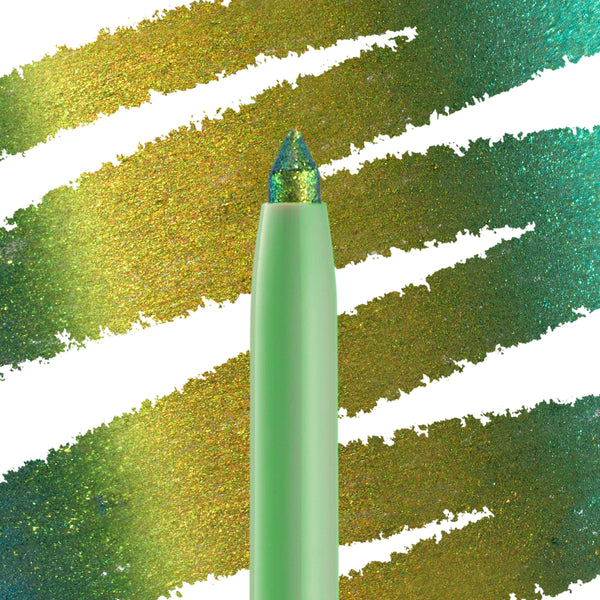 Wild Idea ColourPop Chrome Crème Gel Liner displays a multichrome tip shifting teal, green, and gold, drawing creamy strokes across a swatched backdrop; mint twist-up pencil in macro close-up for bold, long-wear eye looks.