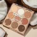 ColourPop Shadow Palette Going Coconuts lies open to reveal a 9‑pan 3x3 grid of warm neutral browns and champagnes in matte and shimmer finishes, styled among cracked coconut halves on a beige surface.