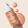 ColourPop Liquid Highlighter Venice Blvd bottle with white dropper rests diagonally, spilling pearly rose-gold glow drops and a swirled swatch on a light beige background, showcasing Liquid Lite Glow Drops' radiant, buildable finish.