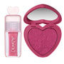Heart to Get Sorry Not Sorry blush + UGL set showing a shimmery hot pink heart-shaped powder blush compact with built-in mirror beside a matching pink liquid lip gloss in a clear tube with heart-shaped cap on a white background.