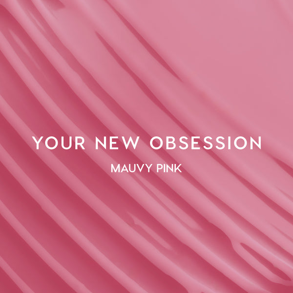 Heart to Get Sorry Not Sorry blush + UGL set swatched in smooth mauvy pink stripes, showing creamy, highly pigmented color payoff against a glossy pink background for modern US makeup lovers.