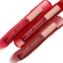Three ColourPop Ultra Matte Lip tubes from the Major Hottie set showcase bold red and berry liquid lipstick shades, laid diagonally across glossy matching swatches; clear barrels with white logos and peach caps with star prints emphasize the ultra matte finish.