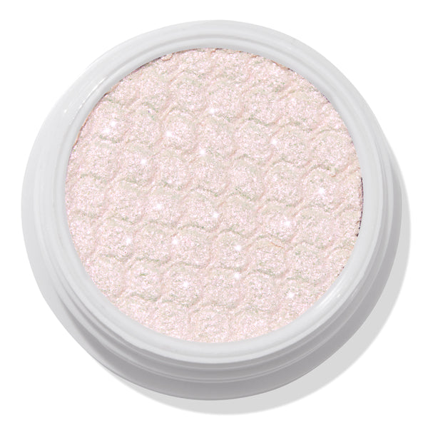 Colourpop Mountain Lion Super Shock Shadow, a pale icy pink shimmer eyeshadow with a metallic, glittery finish and signature bouncy, honeycomb texture in a round white single-pan pot on a white background.