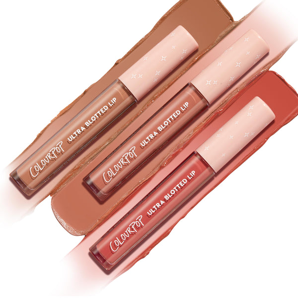 OG Babes Ultra Blotted Lip bundle featuring three ColourPop Ultra Blotted Lip tubes with star-print pink caps, arranged diagonally over swatches in warm nude, peachy nude, and rosy terracotta on a white background.