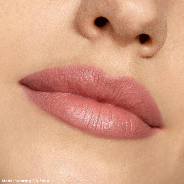 Lips lined and softly filled with Pinky Promise, a rosy pink nude, showing a smooth matte finish in a studio close-up, highlighting precise definition and creamy texture of the ColourPop Lippie Pencil.