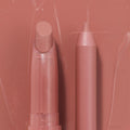 Double the Trouble ColourPop Lippie Stix + Pencil Set shown side by side in a warm rosy nude; the twist-up Lippie Stix and matching precision pencil rest on a glossy pink swatched backdrop, highlighting the coordinated shade for lining and filling lips.