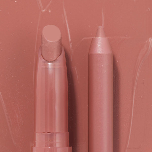 Double the Trouble ColourPop Lippie Stix + Pencil Set shown side by side in a warm rosy nude; the twist-up Lippie Stix and matching precision pencil rest on a glossy pink swatched backdrop, highlighting the coordinated shade for lining and filling lips.