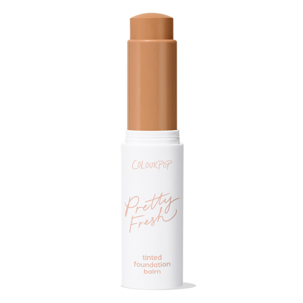 ColourPop Pretty Fresh Tinted Foundation Balm in Medium Dark 16, stick bullet extended from a white tube with rose-gold lettering, standing upright with cap off against a clean white background.
