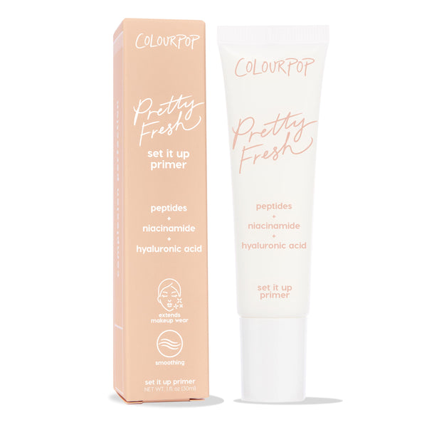 ColourPop Pretty Fresh Primer Set It Up stands upright, peach box next to a white 1 fl oz squeeze tube, highlighting peptides, niacinamide, and hyaluronic acid for smoothing and extended makeup wear against a clean white background.