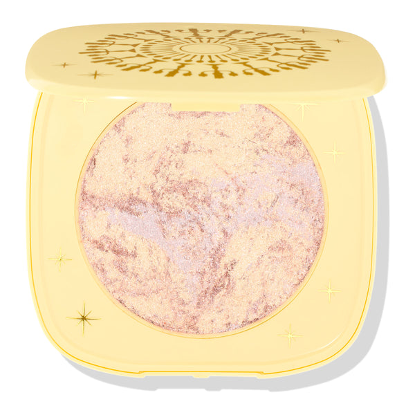 Special Guest ColourPop Super Shock Highlighter compact showing a pink-gold, lavender-shift marbled pan in a pale yellow case with celestial starburst lid design, displayed half-closed on a white background.