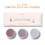 ColourPop Milk Tea and Boba Super Shock Shadow trio displayed with open pans of shimmery mauve, lavender, and icy silver shades beneath a pink limited edition Super Shock Shadow kit box decorated with boba tea illustrations on a white background.