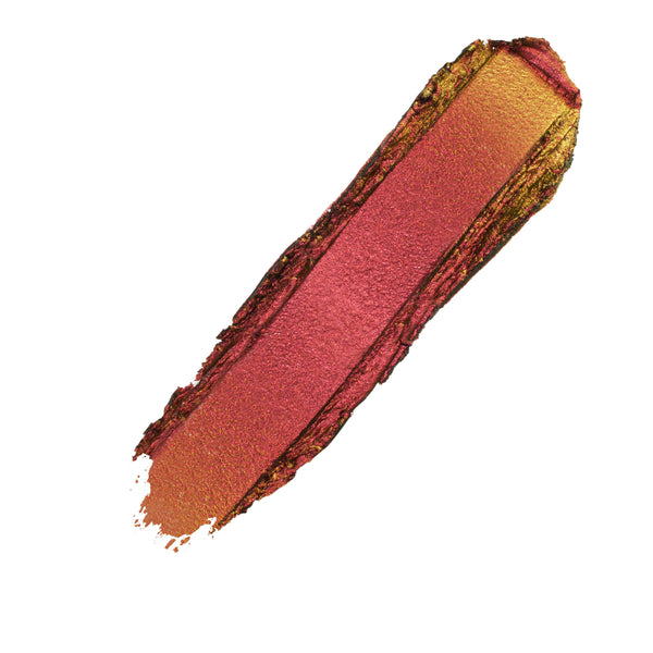 Metallic cranberry-to-gold duochrome swatch streak, ColourPop Shadow Stix in Vampire Girl gliding across a white background, showcasing warm red, copper, and golden shimmer for bold eye makeup.