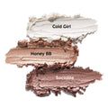 Metallic Neutrals ColourPop Shadow Stix swatches - Cold Girl (icy pearl), Honey BB (champagne gold), Socialite (rosy taupe) - smeared in thick, shimmery strokes on a white background.
