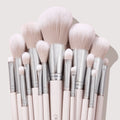Metallic Mood brushes fan out in a tight cluster, showcasing soft blush-pink bristles, chrome ferrules, and pale pink handles on a light backdrop - part of the ColourPop Shadow Palette & Brush Set for precise eye and face makeup.