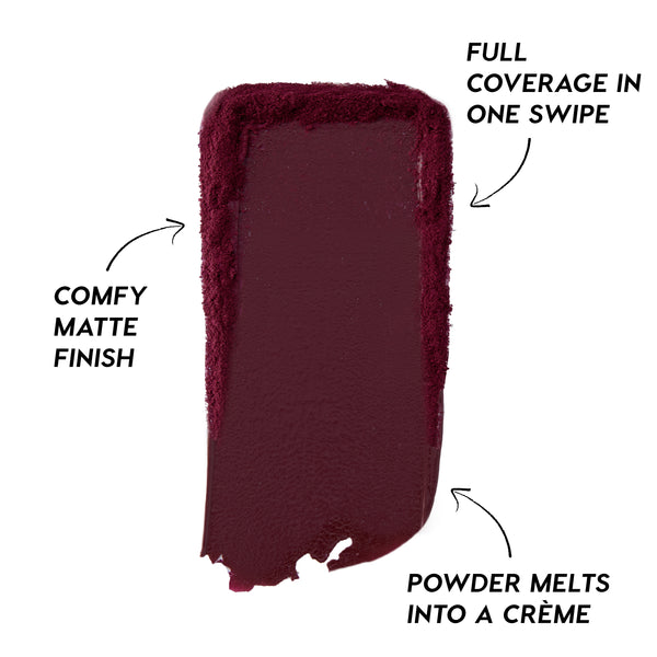Deep berry swipe of Newborn Powder To Creme Lipstick from the Twilight collection, showing rich full-coverage color with a comfy matte finish and creamy texture against a clean white background.
