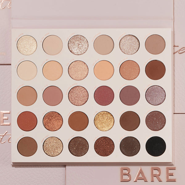 Bare Necessities ColourPop Shadow Palette showcasing 30 neutral matte and shimmer shades in a 6x5 grid - ivory, taupe, mauve, bronze, gold, deep brown, and black - laying open on blush-pink packaging with BARE lettering, ideal for everyday looks.