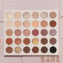 Bare Necessities ColourPop Shadow Palette showcasing 30 neutral matte and shimmer shades in a 6x5 grid - ivory, taupe, mauve, bronze, gold, deep brown, and black - laying open on blush-pink packaging with BARE lettering, ideal for everyday looks.