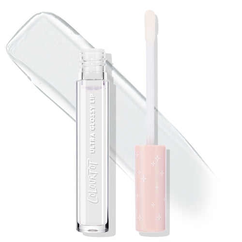 ColourPop Ultra Glossy Lip 20 Carats shown with clear gloss tube and doe-foot applicator, cap off; pastel pink cap with white star accents, transparent high-shine swatch behind on white background.