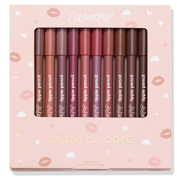ColourPop Truth or Bare Lippie Pencil kit showcases 10 creamy lip liners in nude, pink, mauve, and brown shades, lined upright behind a clear window in a blush-pink box with hearts, clouds, and lip prints - an everyday neutral gift set.