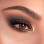 Smoky neutral eye showcases matte-to-shimmer browns blended from the Bare Necessities ColourPop Shadow Palette, shades sweeping from taupe to deep espresso with a champagne inner-corner highlight on a model’s brown eye with full lashes.