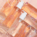 Come Clean Cleansing Duo pump bottles clustered together, filled with peach-tinted gel and speckled with suds, on a soft pink backdrop; a ColourPop Face Cleanser set for daily AM/PM cleansing with sleek white pumps and clear labels.