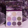 Open All Amethyst ColourPop Shadow Palette displays nine purple-toned shades - lilac, lavender, mauve, plum, and taupe - in matte and shimmer finishes (Brilliant, High Grade, Sunbird, Crystal Crazy), set against raw amethyst crystals.