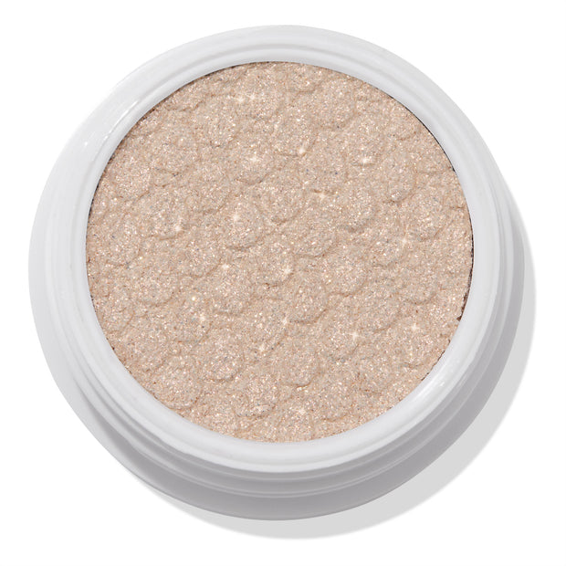 ColourPop 3rd St Super Shock Shadow showing a shimmery champagne‑beige eyeshadow with the signature bouncy, scale-texture pressed finish, sitting in a white round pot against a clean white background.