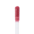 Doe-foot applicator coated in the All Me shade of ColourPop Ultra Glossy Lip, a high-shine rosy pink gloss, shown in an extreme close-up on a white background.