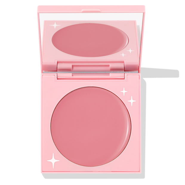 Angel Energy ColourPop Cream Blush compact opened to reveal a rosy-pink pan and mirror, housed in a pastel pink square case with white star accents on a clean white background.