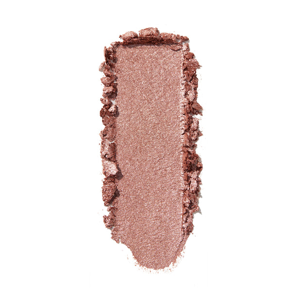 Aster ColourPop Super Shock Shadow swatch, metallic rose‑gold shimmer, swept in a single opaque swipe with crushed edges on a white background, showcasing its creamy texture, high pigment payoff, and reflective sparkle.