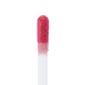 Doe-foot applicator swipes rosy pink Attention Plz Ultra Blotted Lip, showcasing creamy soft-focus pigment on a fuzzy wand against a clean white background; ColourPop Ultra Blotted Lip macro highlights the blotted, diffused finish.