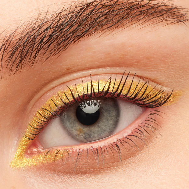 Black on Black BFF Mascara coats and separates lashes on a grey eye, paired with metallic gold eyeliner and a natural brow, highlighting the deep black finish of ColourPop BFF Mascara.