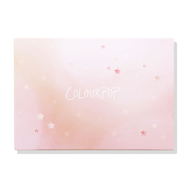 ColourPop Stars Large Empty Palette closed and front-facing, displaying a pink ombré lid sprinkled with star graphics and the COLOURPOP logo on a white backdrop; ColourPop Empty Palette for customizing shades.
