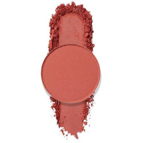 Balancing Act pressed powder shadow pan spills crushed warm terracotta pigment on a white background, highlighting a matte finish; ColourPop Pressed Powder Shadow single pan for buildable eye color.