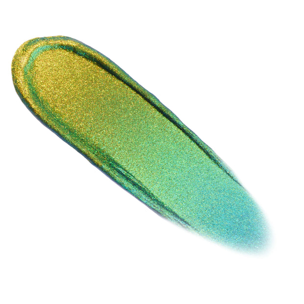 Beetle Chrome Liquid Shadow swatch shifting from golden olive to emerald and teal, gliding in a smooth elongated swipe on a white background, showcasing the high-shine, sparkly multichrome finish of the ColourPop Chrome Liquid Shadow.