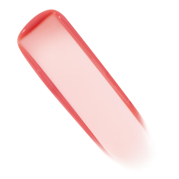 Coral-pink, semi-sheer swatch of Bengal shade from ColourPop Lux Lip Oil sweeping diagonally across a white background, highlighting glossy shine and smooth texture.