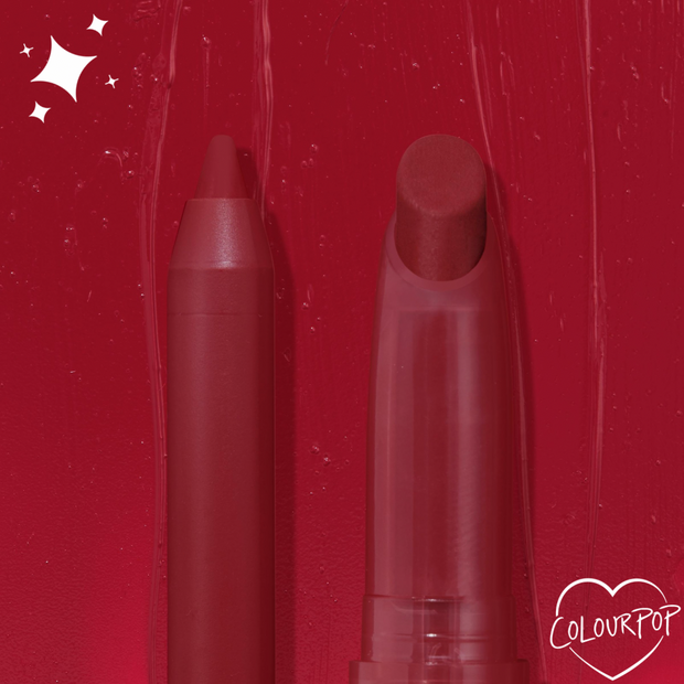 ColourPop Lippie Pencil in Bichette stands uncapped beside the matching Lippie Stix on a glossy deep red swatch background with sparkle accents and a heart-shaped ColourPop logo, showcasing its rich wine-red shade and precise tip.