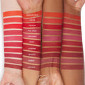 Love Bug Lippie Pencil swatch - a rich terracotta brown - displayed on three arms at the bottom of labeled shade stripes, showcasing the pigment and matte finish of the ColourPop Lippie Pencil across multiple skin tones.