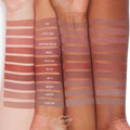Ashton ColourPop Lippie Pencil swatched on three forearms, a mid‑tone nude brown stripe labeled “ASHTON” among other shades, showing smooth matte payoff and how the lip liner appears on light, medium, and deep skin tones.
