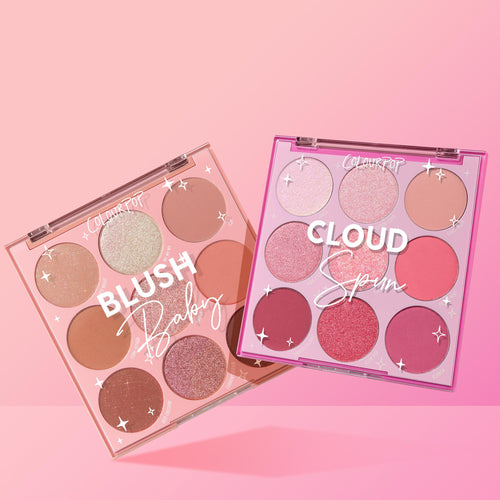 Cloud Baby ColourPop Shadow Palette Set shows two open 9‑pan compacts - Blush Baby and Cloud Spun - displaying nude and pink mattes and shimmers in clear-lid cases with star accents, overlapped on a pink gradient backdrop.