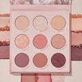 Blushing Nude ColourPop Shadow Palette Set showcases nine rosy neutral eyeshadows - matte, shimmer, and metallic - in a pink compact with shade names like Pop a Bottle and Blush Wine, shown over coordinating swatches for color payoff.