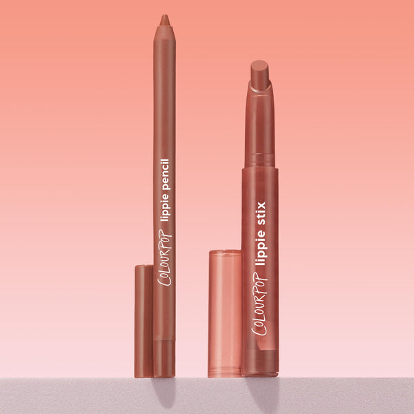 Brat Pack Lippie Stix and ColourPop Lippie Pencil duo standing upright with caps off, revealing creamy mauve‑nude tips on a minimalist ledge against a pink gradient background, highlighting a coordinated lip liner and lipstick set.
