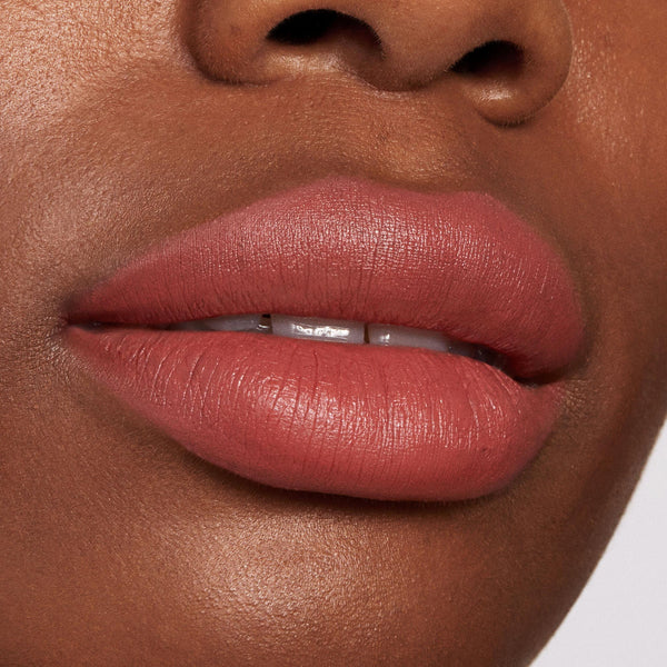 Brink ColourPop Lippie Pencil lining and filling lips in a warm rosy terracotta nude, delivering precise, full-coverage color with a soft matte finish in a close-up beauty swatch of the lip liner’s smooth, feather-free payoff.